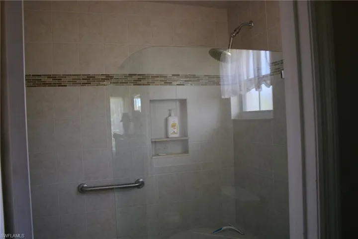 Bathroom with tiled shower