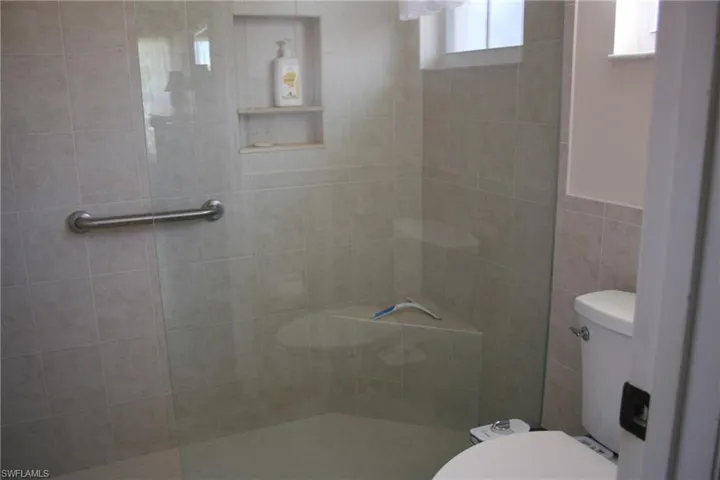 Full bathroom with walk in shower and toilet
