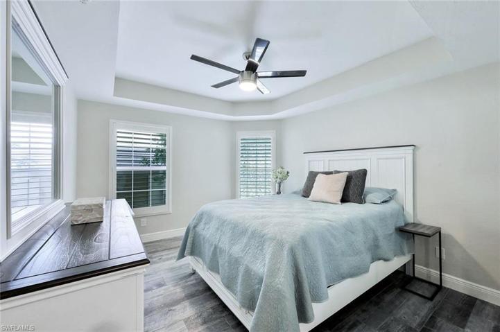 Guest bedroom #1 is spacious and features trey ceiling and ceiling fan