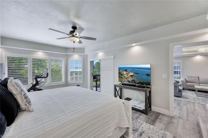 Primary bedroom view of lanai and living area