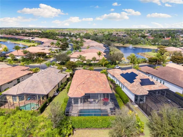 Aerial perspective of suburban area featuring a large body of water