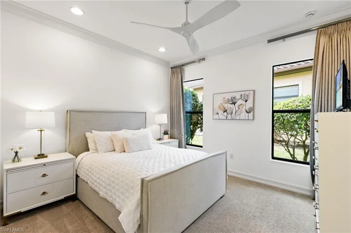 Bedroom featuring light carpet, crown molding, ceiling fan, and recessed lighting