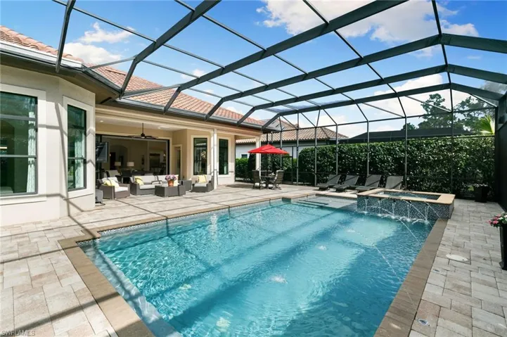 Integrated pool / spa featuring outdoor furniture, a lanai, a sunroom, and a patio area