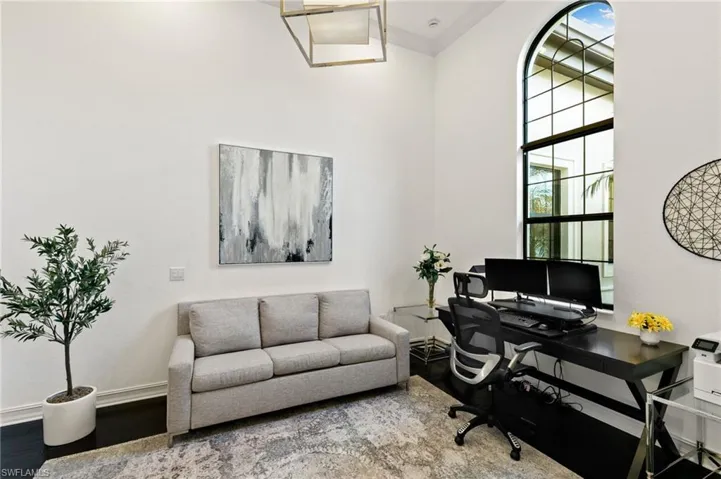 Office space with crown molding and wood finished floors. Can be used as the 4th bedroom.