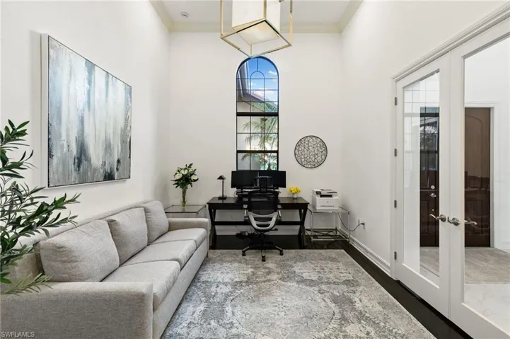 Home office featuring French doors, ornamental molding, and wood finished floors. Can be used as 4th bedroom.