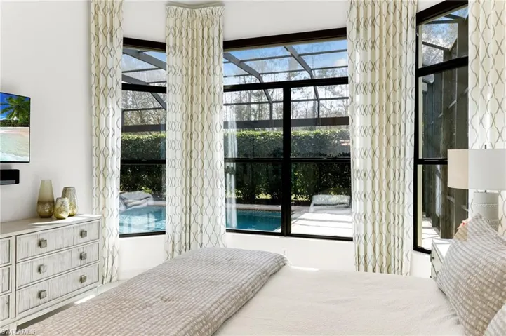 Bedroom featuring multiple windows
