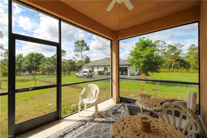 Sunroom / solarium with a ceiling fan