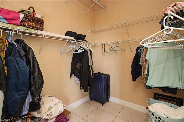 Walk in closet featuring light tile patterned floors