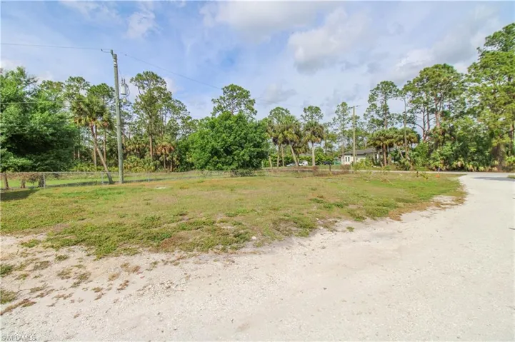 View of yard featuring fence