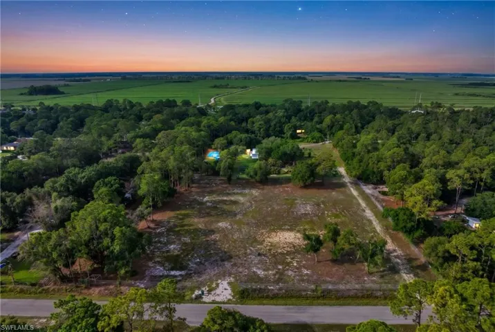 Expansive parcel featuring a blend of cleared land and mature tree coverage