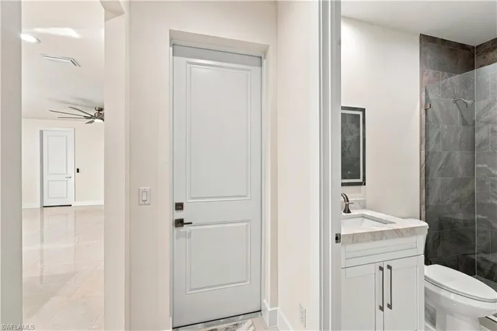 White paneled interior doors with dark bronze hardware