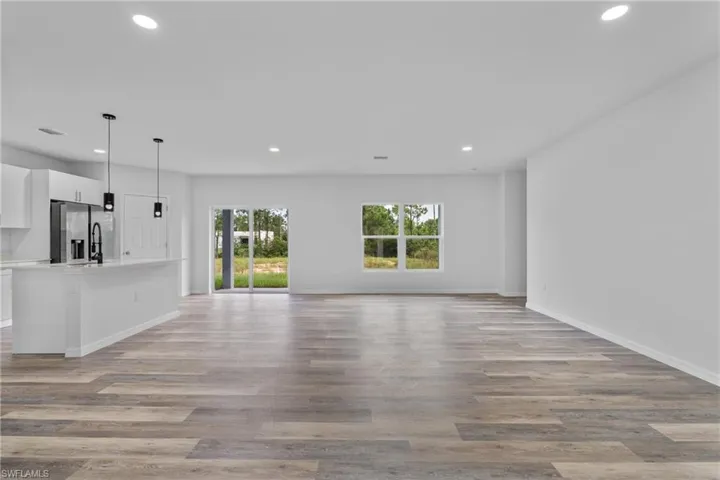 Unfurnished living room featuring recessed lighting and light wood-style flooring