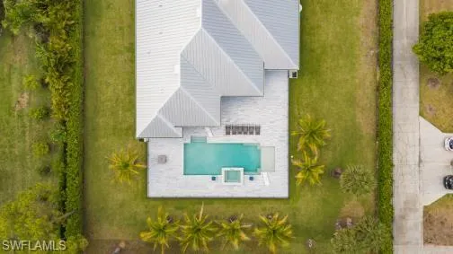 View of subject property featuring a pool area