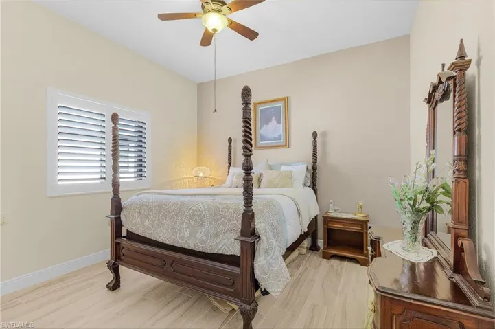 Bedroom featuring light wood-type flooring and ceiling fan