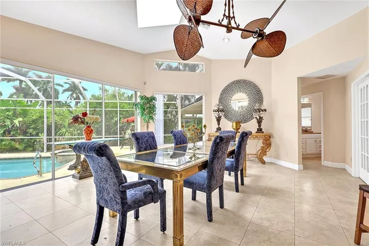 Dining area with tile flooring and a decorative ceiling fan