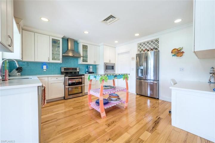 Quartz Counter Tops, Stainless Appliances, Built-in Wine Rack, and Desk Area