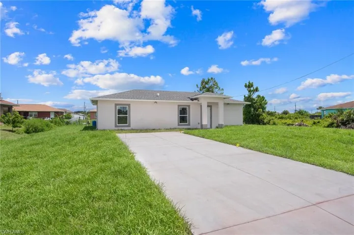 View of front of house with a front lawn