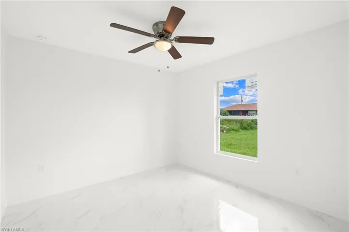Unfurnished room with ceiling fan