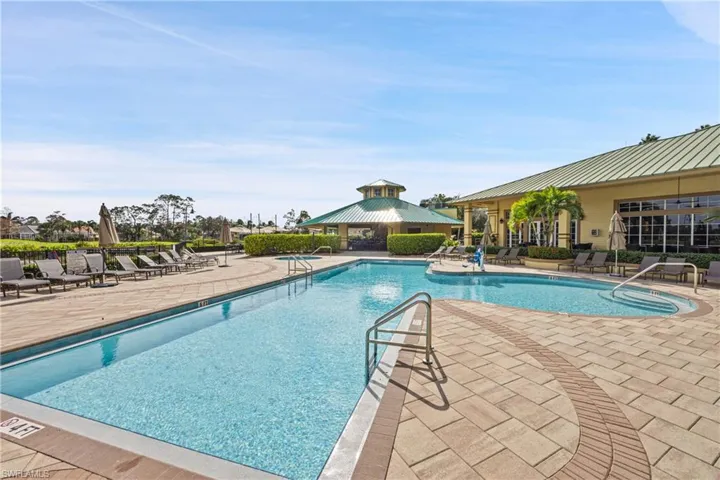 View of main swimming pool with a gazebo and a patio area