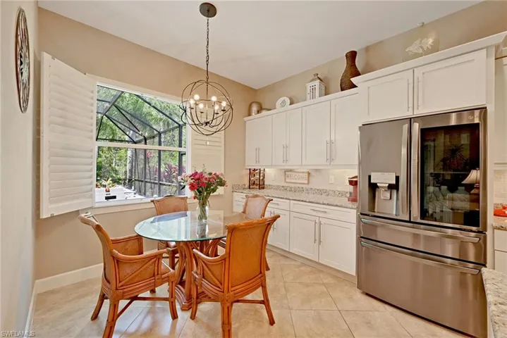 Extended cabinetry and granite counter in breakfast nook.