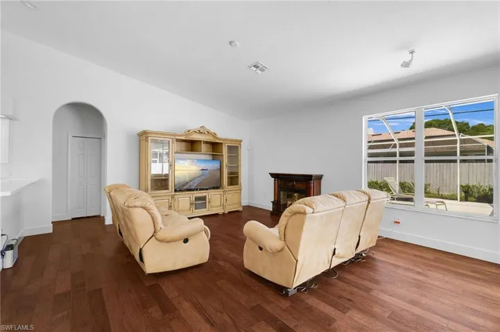 Living area with rich wood flooring.