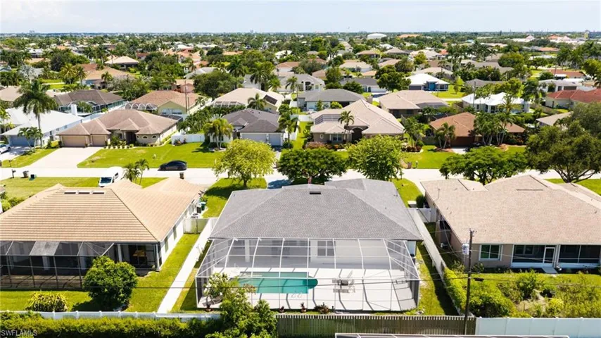Screened-in pool with a paved deck