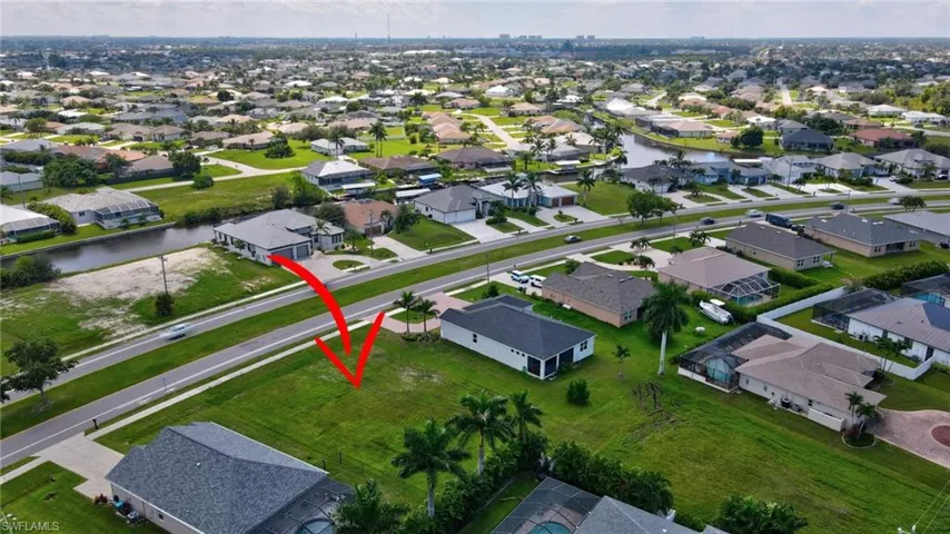 View of property location with nearby suburban area