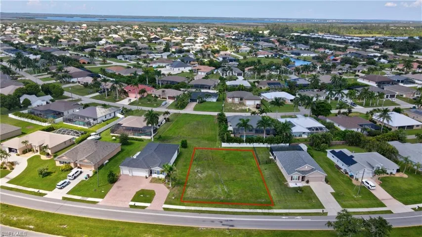 Aerial perspective of suburban area with property parcel outlined