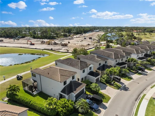 Birds eye view of property featuring a residential view and a water view