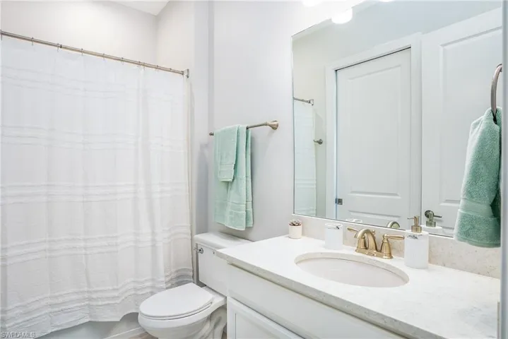 Full bathroom with vanity and toilet