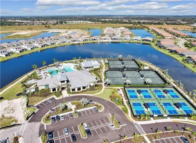 Aerial overview of property's location with a large body of water and nearby suburban area