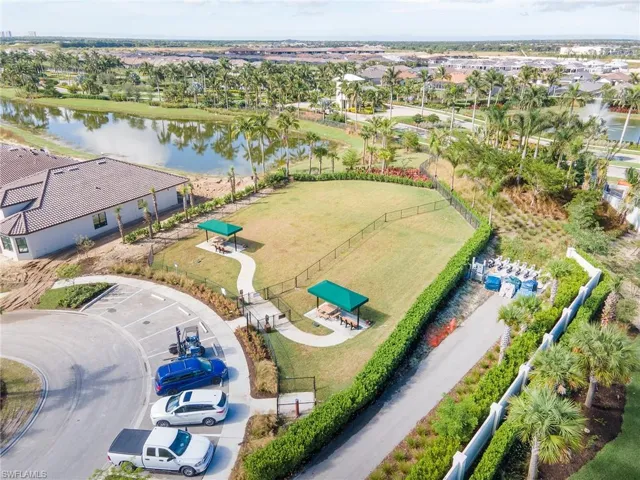Aerial perspective of suburban area featuring a large body of water
