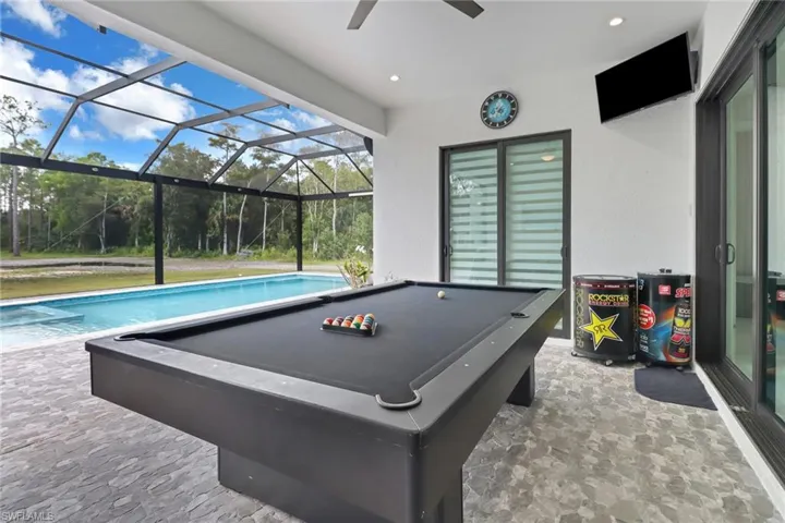 stone finish flooring, recessed lighting, healthy amount of natural light, and ceiling fan