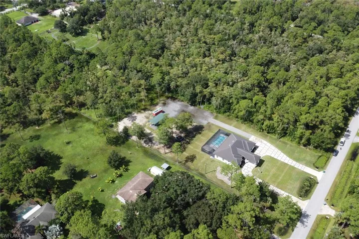 View of property location featuring a heavily wooded area
