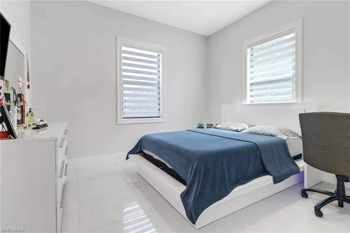 Bedroom featuring light tile patterned flooring