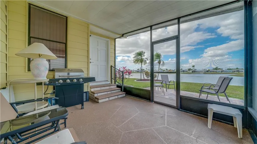 Yes! Yes! Another bonus room. Another room with a view! Notice the stamped concrete patio.