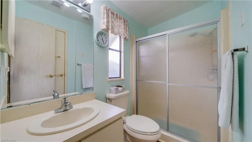 The master bath features a large walk in shower and a raised toilet.
