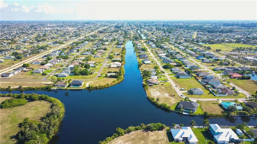 Aerial view of residential area with a large body of water