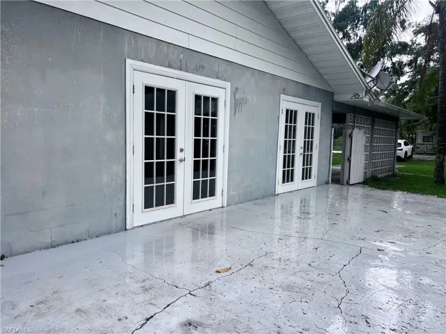 View of home's exterior featuring a patio area and french doors