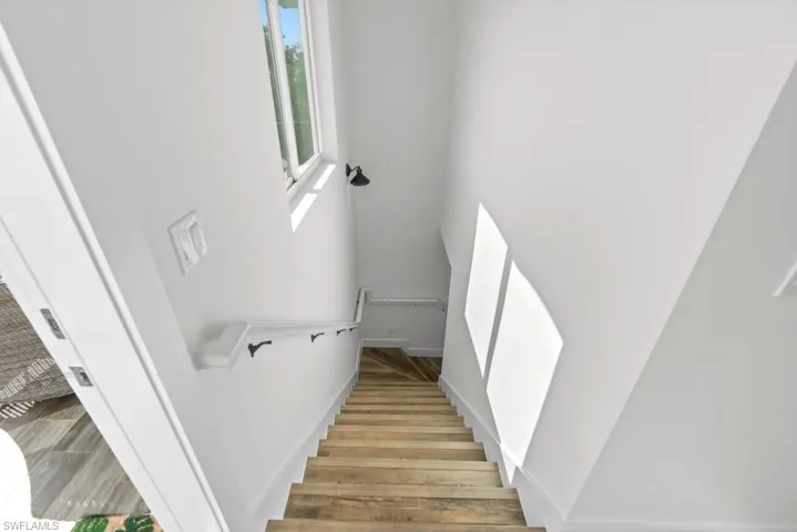 Staircase with wood-type flooring