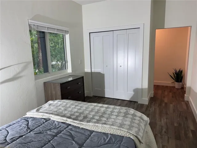 3rd Bedroom featuring dark hardwood / wood-style floors and a closet