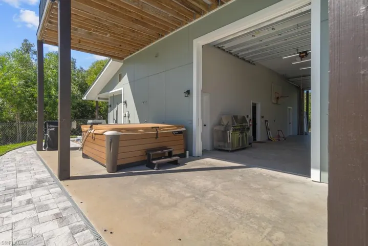 View of patio / terrace with a hot tub