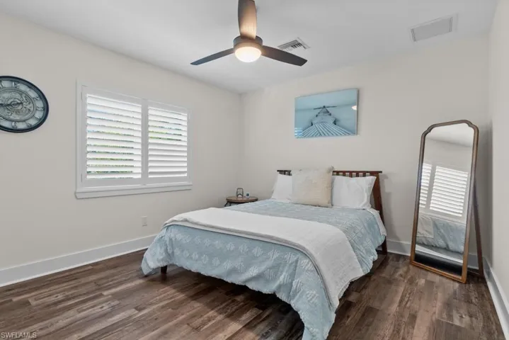 2nd Bedroom with dark wood-type flooring and ceiling fan