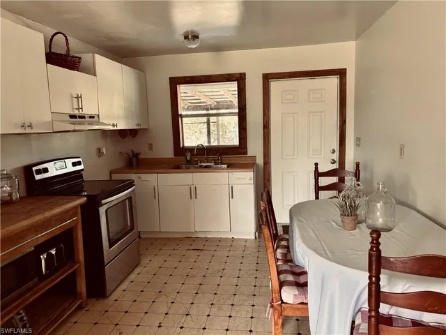 Eat-in kitchen leading to back porch