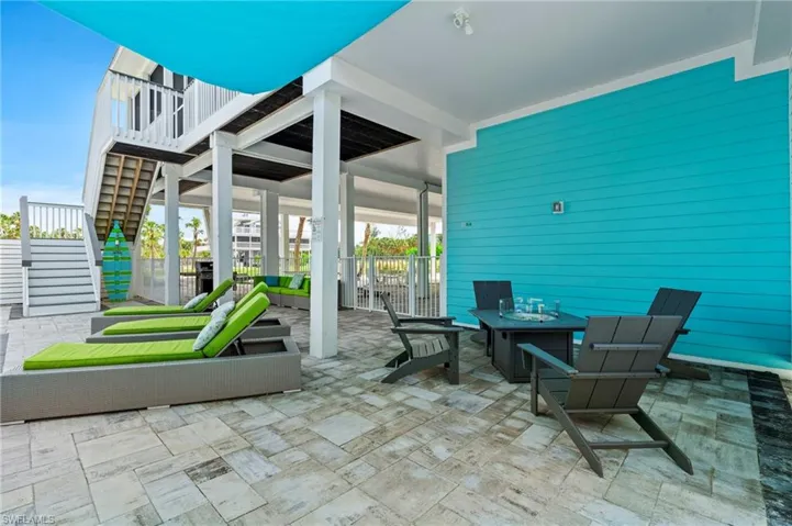 Patio features covered areas for shade and open areas for sunning.  Propane fire table.