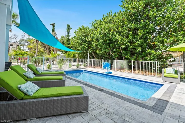 Pool lounge area.  All pool equipment controlled by your phone app.