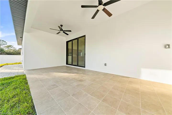 View of patio featuring a ceiling fan
