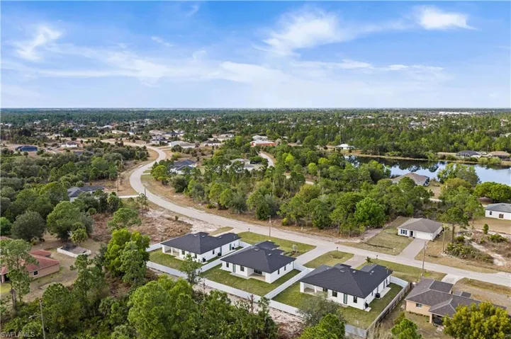 Aerial view of residential area with a tree filled landscape