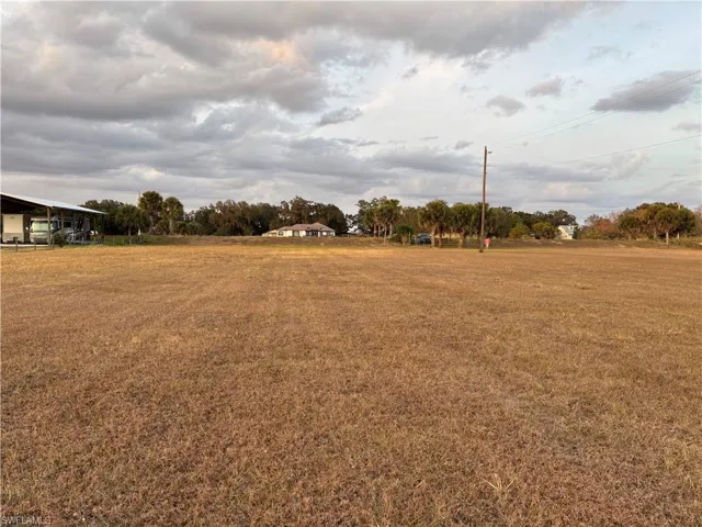 View of green lawn with a view of rural /pastoral area