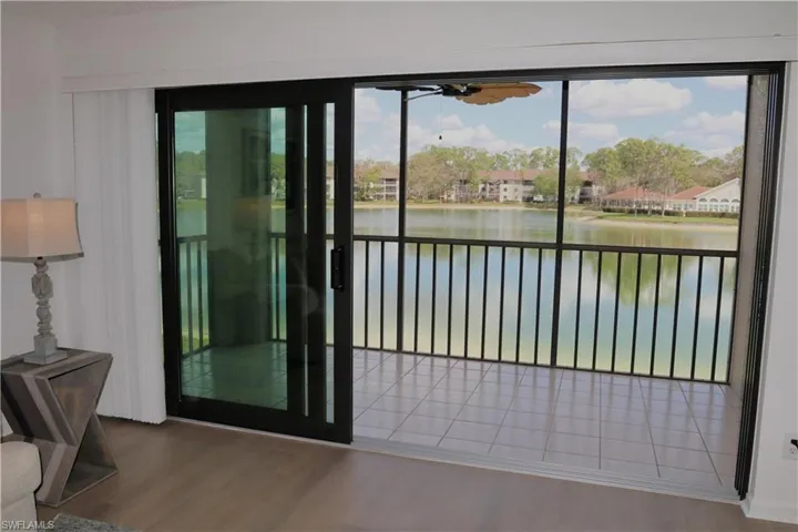 Doorway to outside featuring wood finished floors and a water view